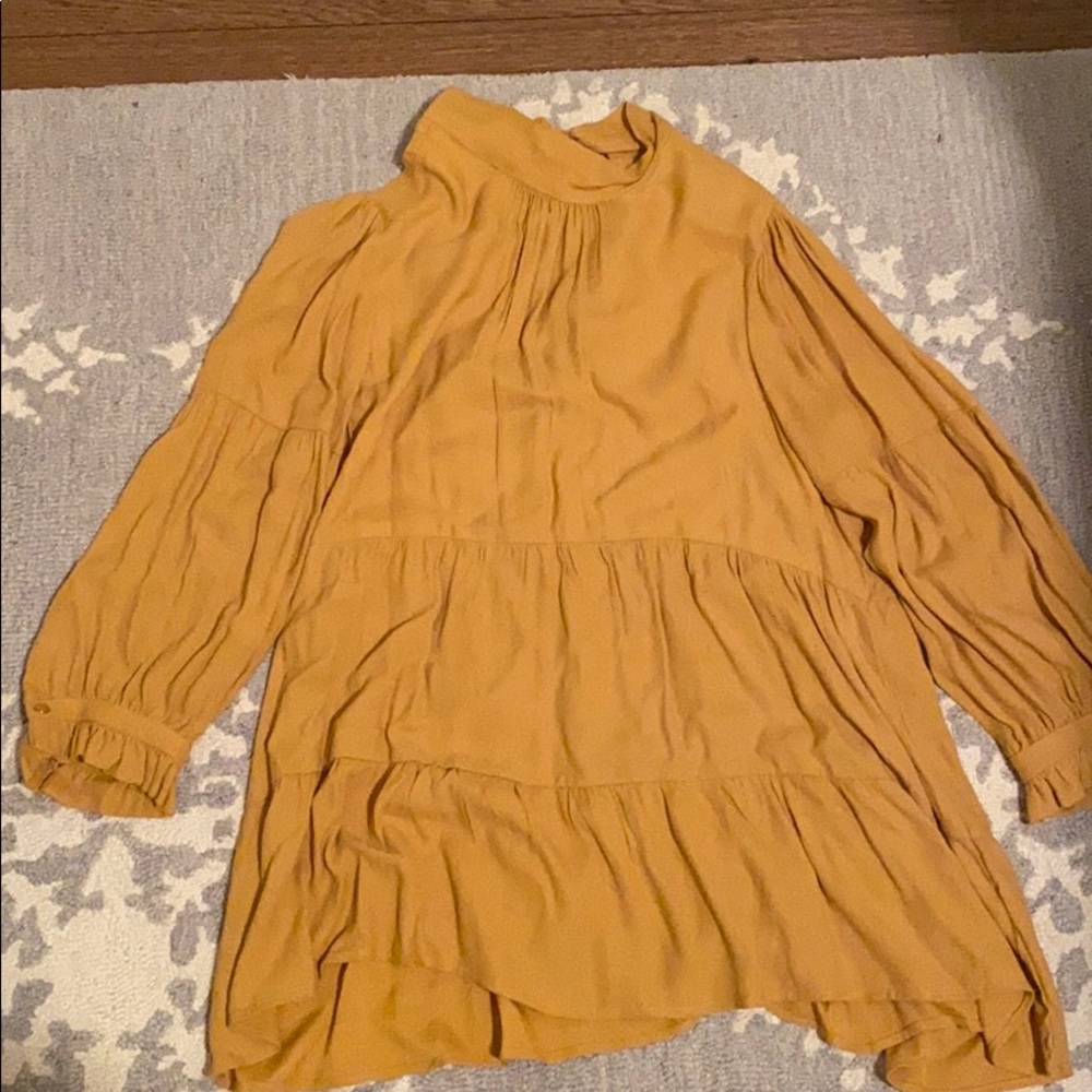 Anthro tiered tunic tie back top size M